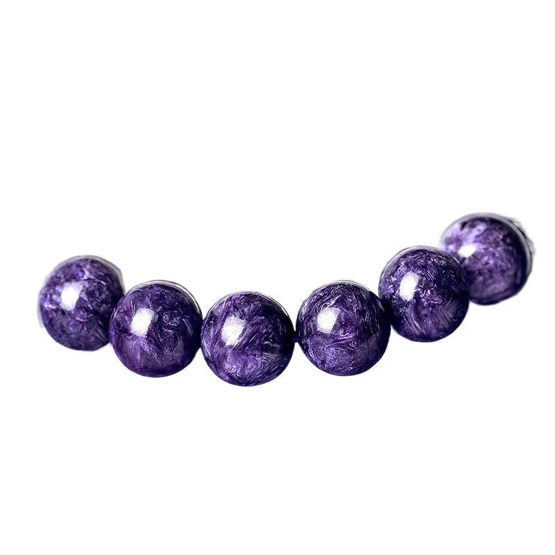 Natural purple charoite crystal bracelet with platinum tone metal chain, showing four bead size options.