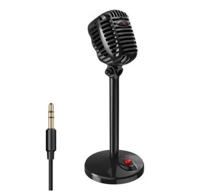 Black USB computer microphone with adjustable stand on desktop for recording