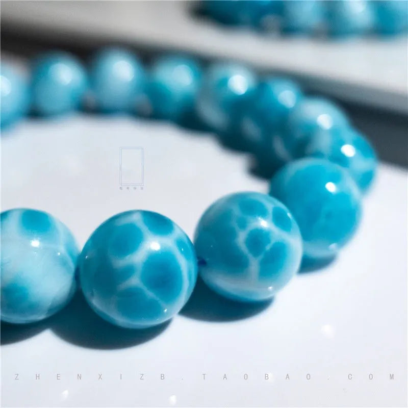 Blue natural crystal sea-pattern stone and Bodhi seed bracelet with pearl accents in Maillard style.
