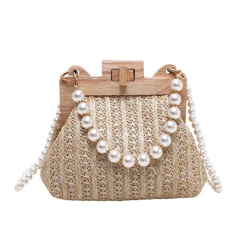 Women's straw shoulder bag with pearl chain strap in beige colour showing organised interior with compartments