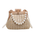 Women's straw shoulder bag with pearl chain strap in beige colour showing organised interior with compartments