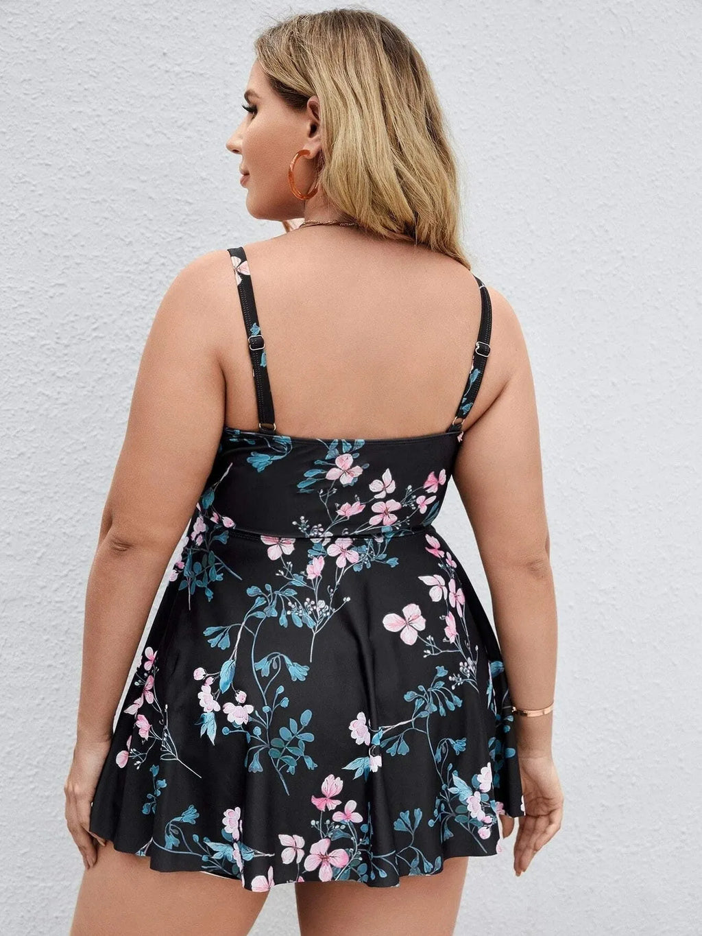 Women's one-piece floral print swimsuit with split colours, shown in extended sizes.