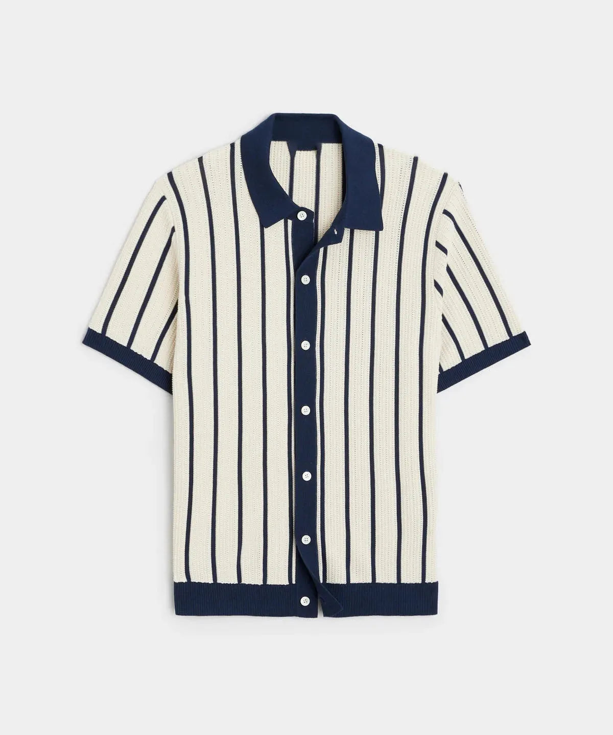 Men's white short sleeve knitted shirt with an asymmetric lapel, laid flat.