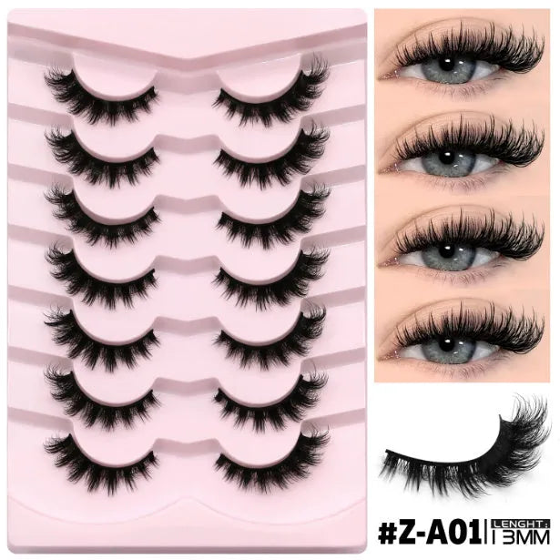Box of natural style false eyelashes made from artificial fibre, includes adhesive glue