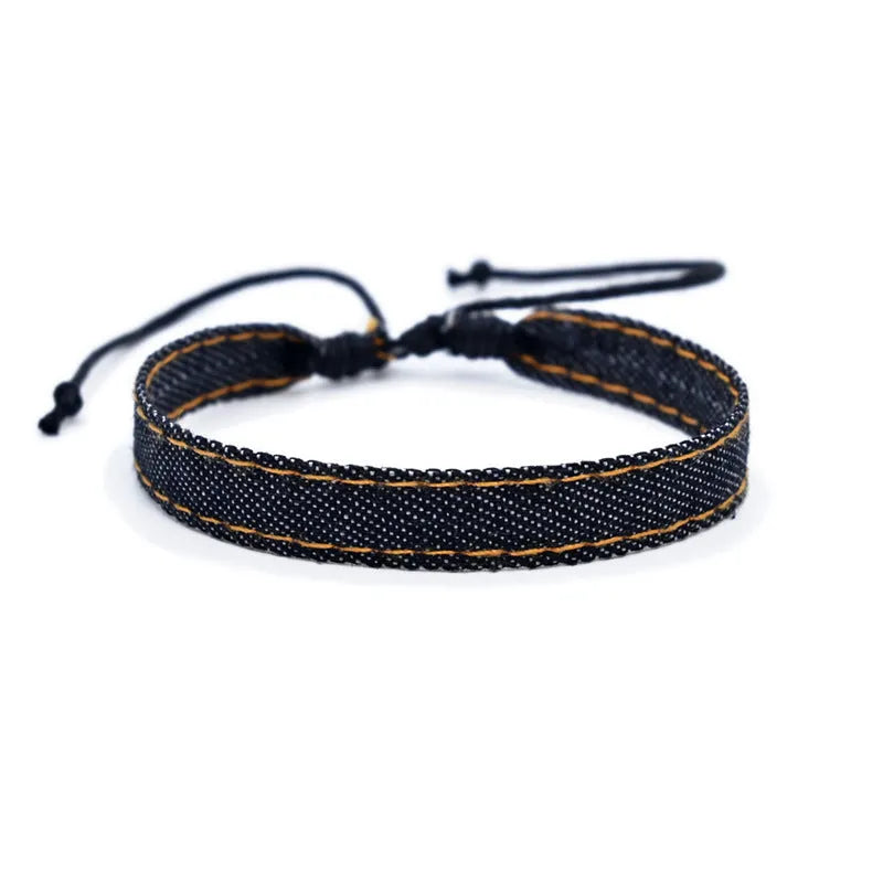 Denim fabric bracelet carrying strap in unisex design with mixed materials and cute styling