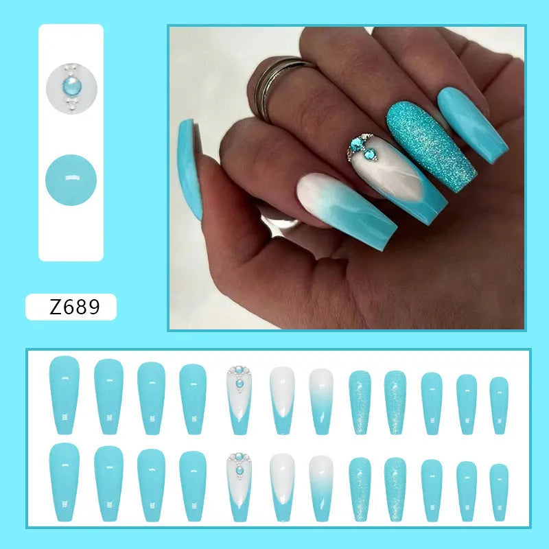 Long ballet shaped false nails in a solid smart blue diamond colour with glue.