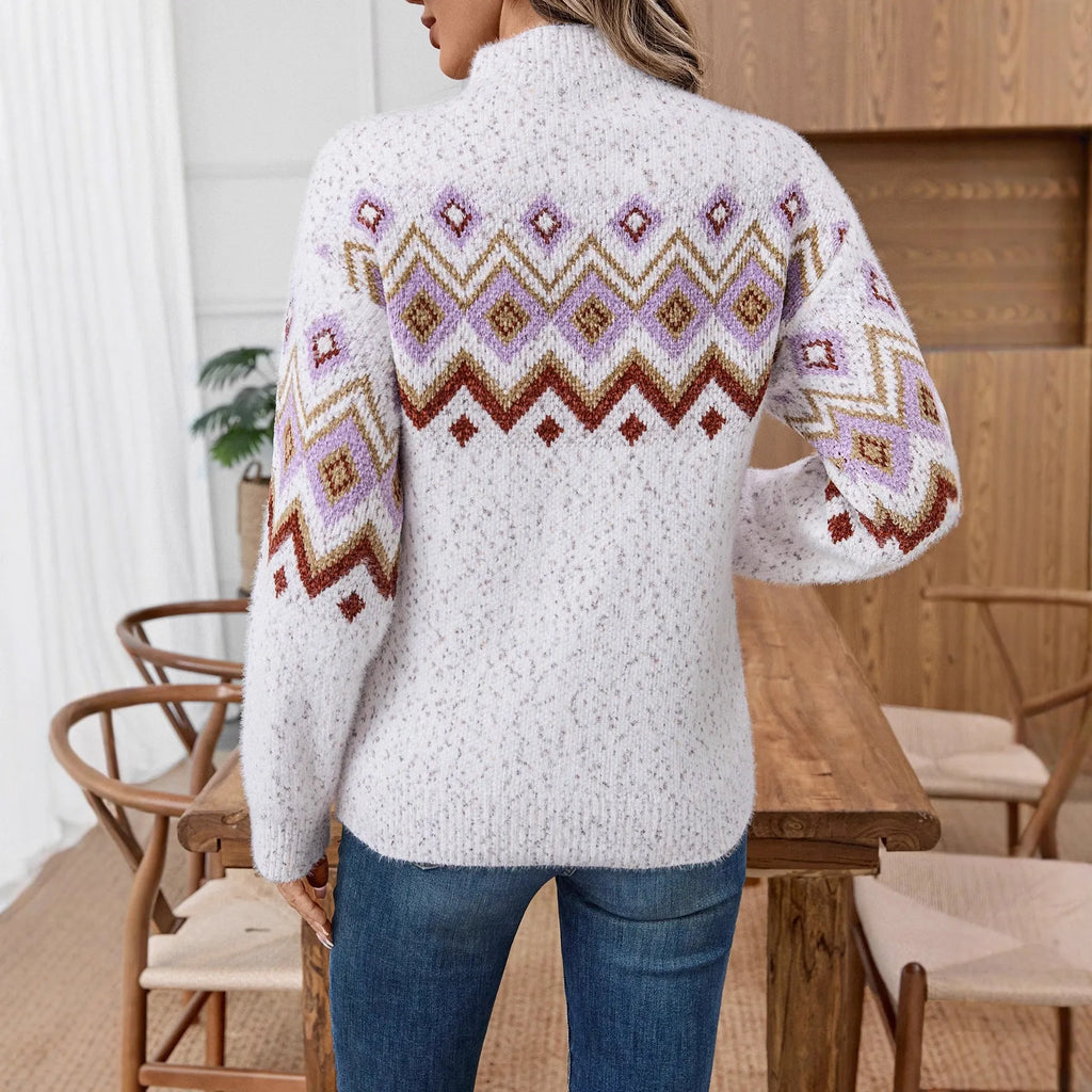 White half turtleneck loose sweater with geometric jacquard pattern and long sleeves on a model.