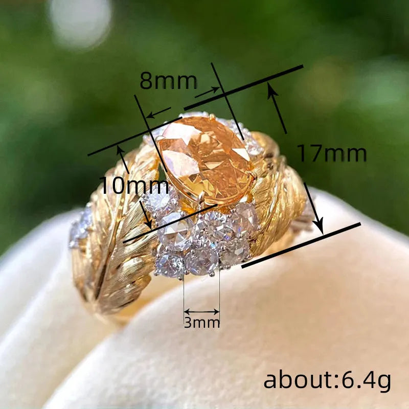 Women's gold geometric feather ring with yellow zircon stones on copper band