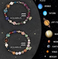 Natural stone beaded bracelets with zodiac symbols on stretchy elastic cord, showing two bracelets in set.
