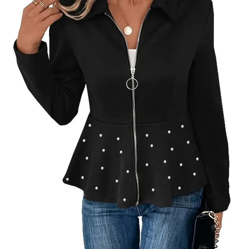 Women's black loose fit coat with beaded zipper and ruffle hem on a hanger.