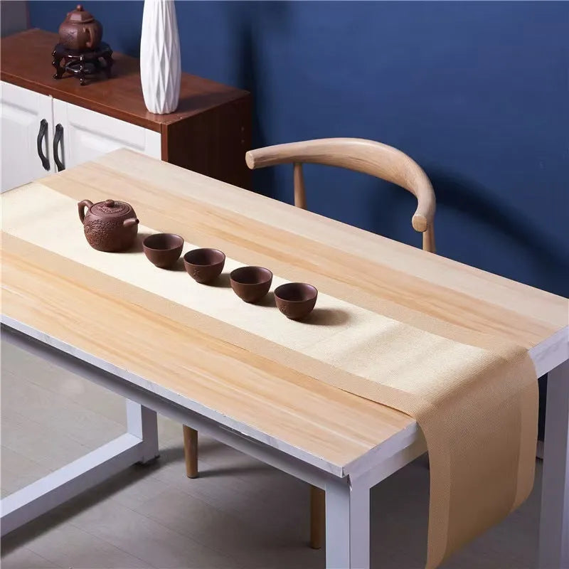 Modern PVC non-slip placemat in gradient bamboo colour on a table.