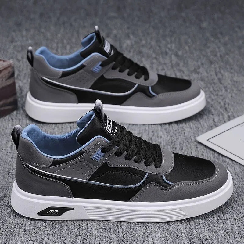 Men's low-top canvas shoes in black with leather stitching and mesh lining, shown on a white background.