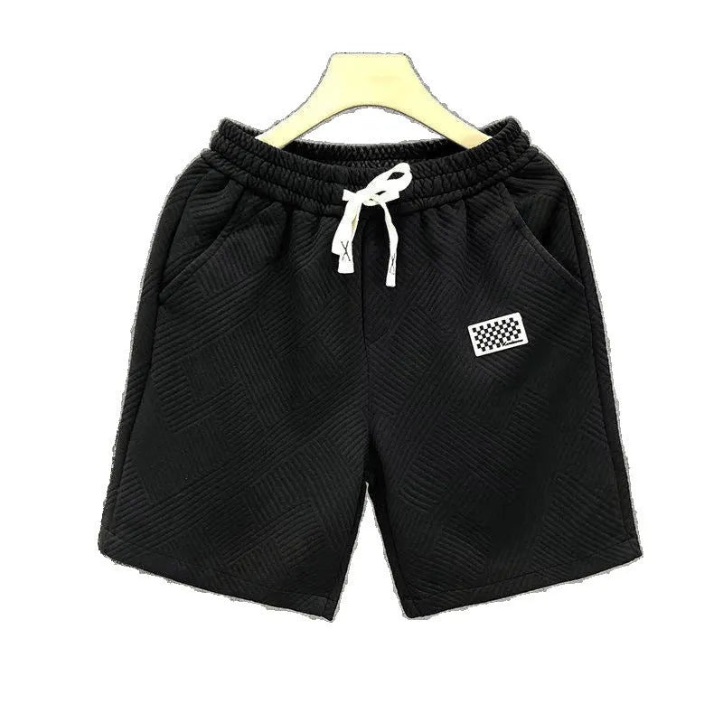 Men's solid colour polyester sports shorts with micro elasticity in white, black, or green.