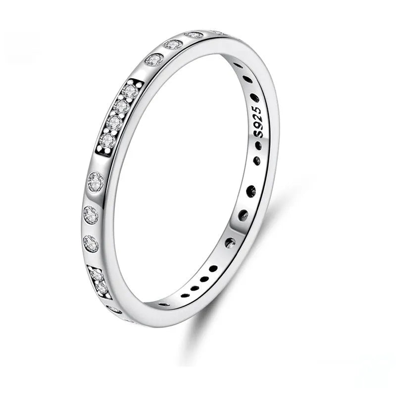 Women's oxidised black silver 'I Love You' ring with moss password design on a hand.