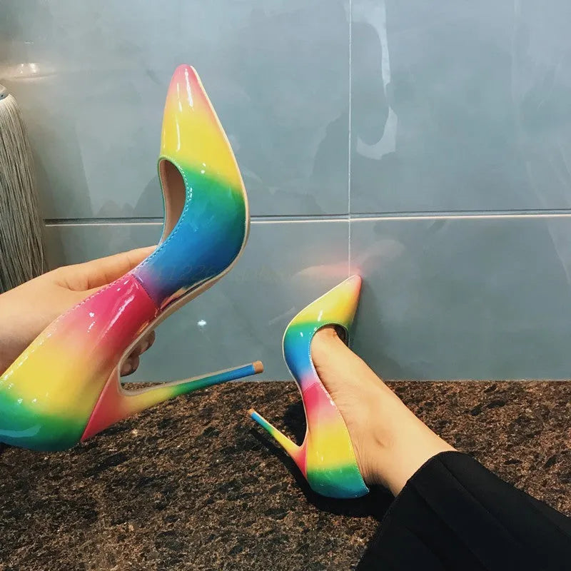 Rainbow patent leather women's ultra-high heel shoes with pointed toe and thin stiletto heel.