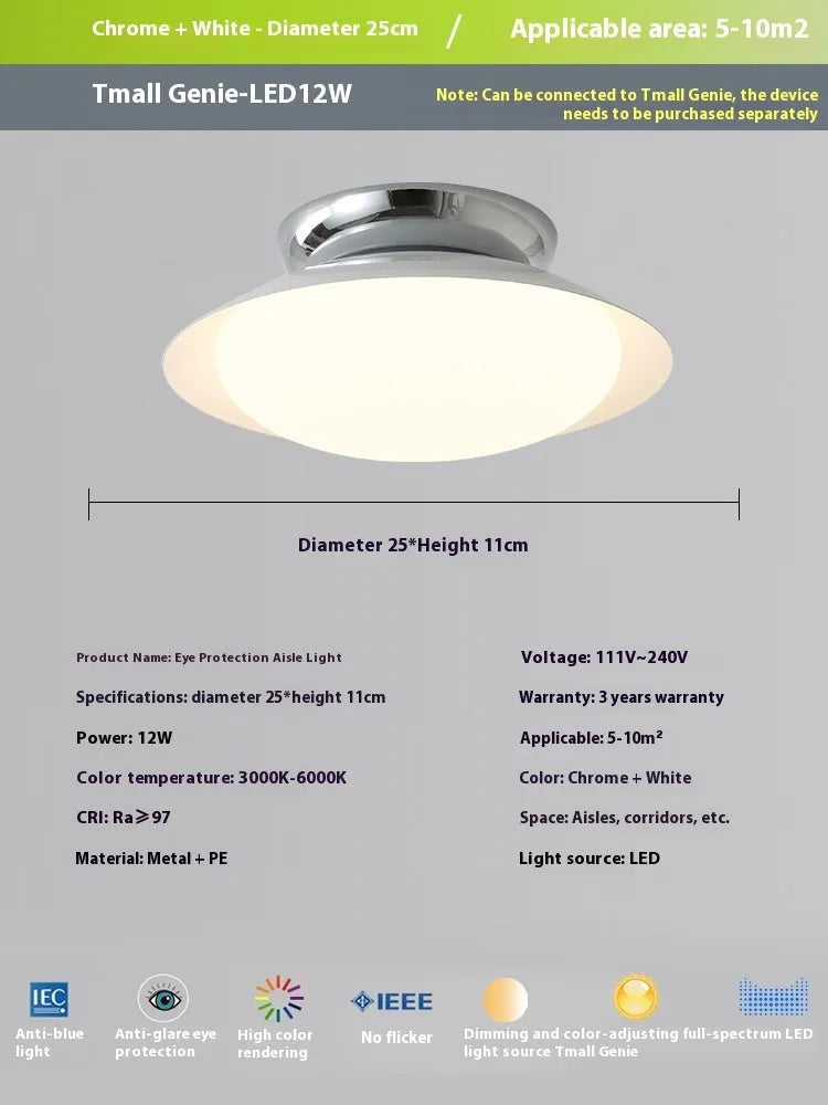 Modern flying saucer shaped ceiling lamp with an iron shade, shown in a cream yellow finish.