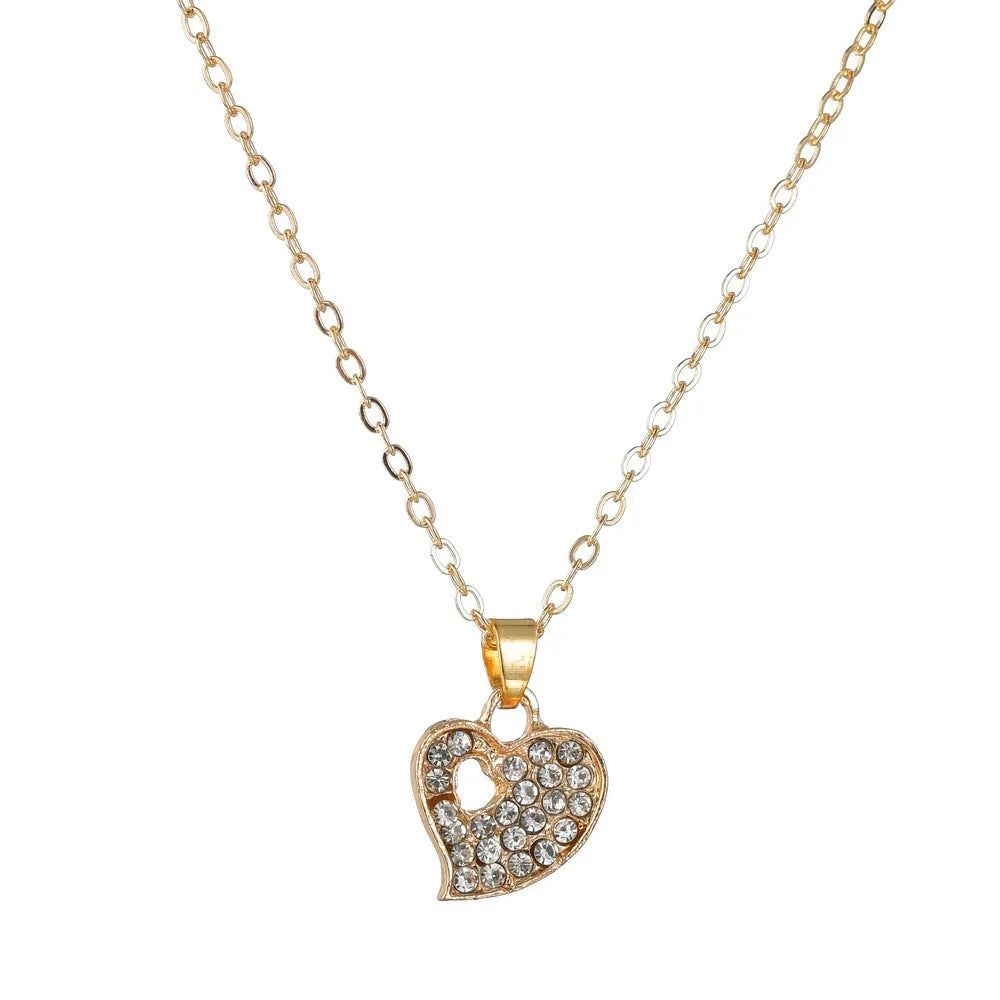 Gold-colour women's jewellery set with earrings, adjustable necklace and bracelet featuring heart, water drop and bell charms.