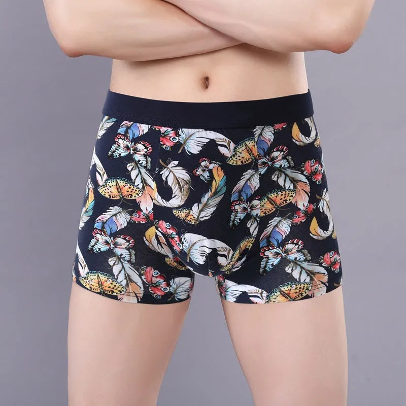 Men's cotton boxer briefs on a white background, showing the U-shaped pouch design and a floral pattern.