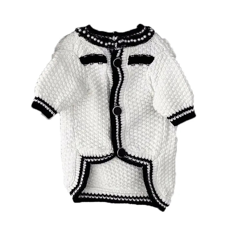 White Korean-style dog sweater with pearl collar on a small puppy, showing princess fit and detailing.