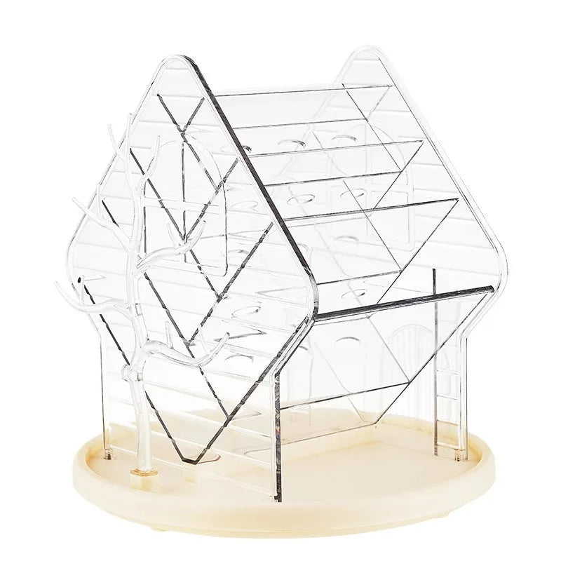 Clear and amber gold rotating cosmetics storage box organiser on a table.