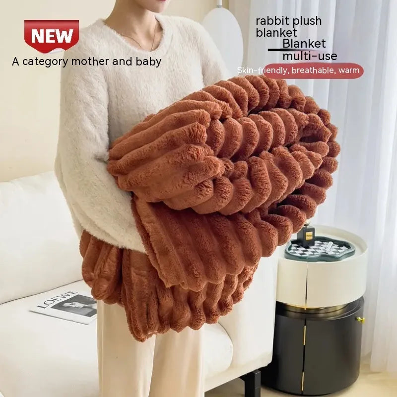Soft Wind double-sided thickening bubble velvet blanket in a solid colour shown on a sofa.