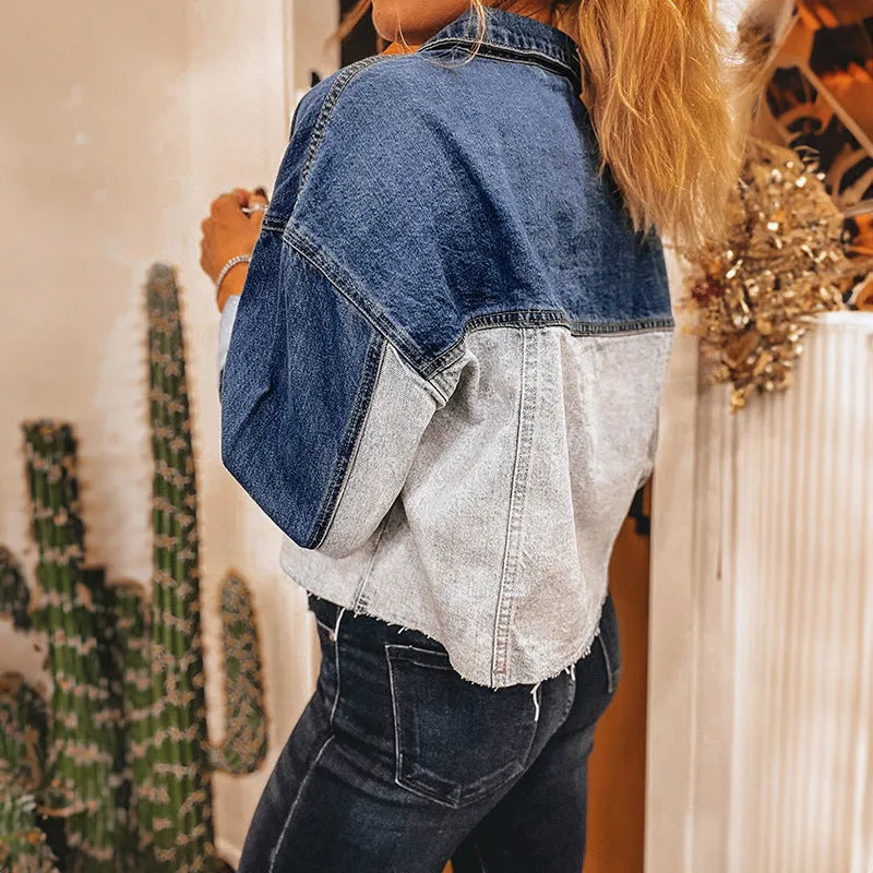 Loose fit women's denim coat with multi-buckle front on hanger.