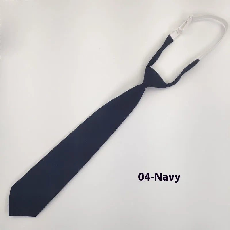 Men's navy blue cotton bow tie with arrow-style design on a white background.