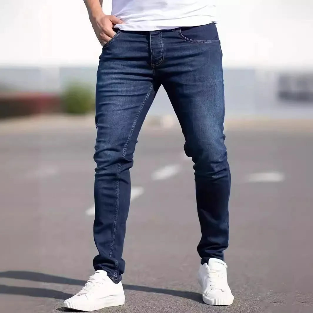 Men's dark blue slim casual jeans with medium elastic waist and skinny leg style