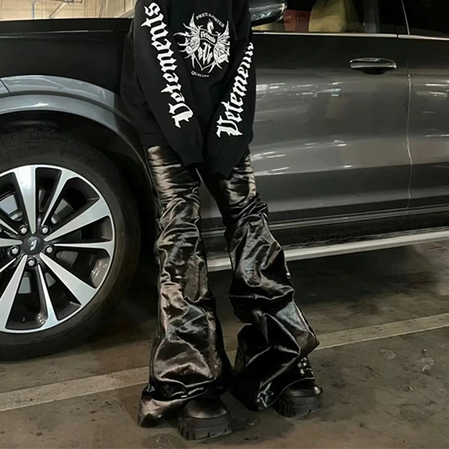 Black shiny patent leather skinny jeans with straight leg cut and mid-rise waist