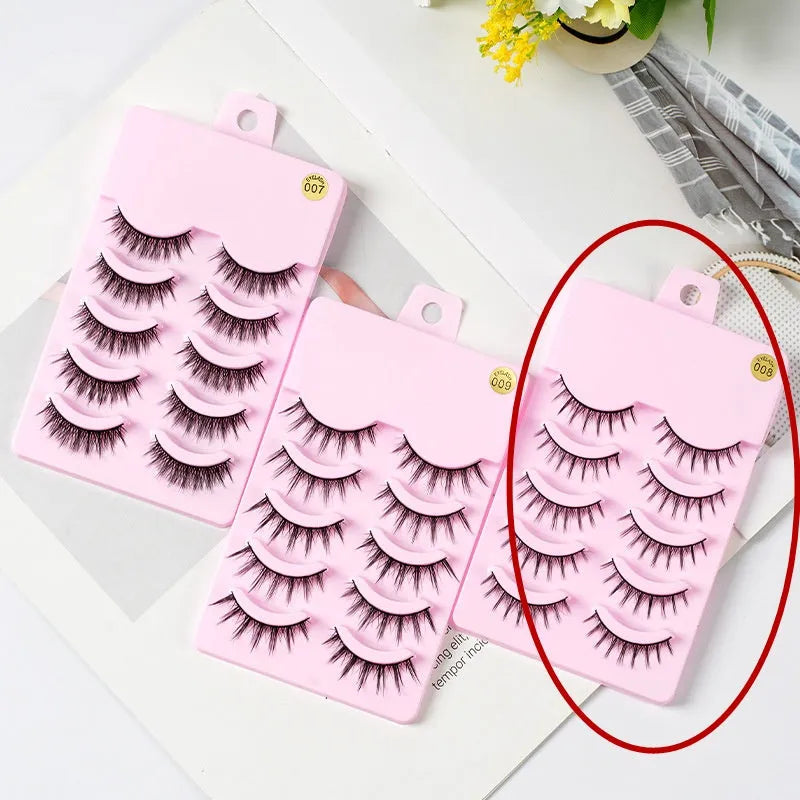 Five pairs of natural wispy false eyelashes on a card for manga anime cosplay and Korean style makeup.