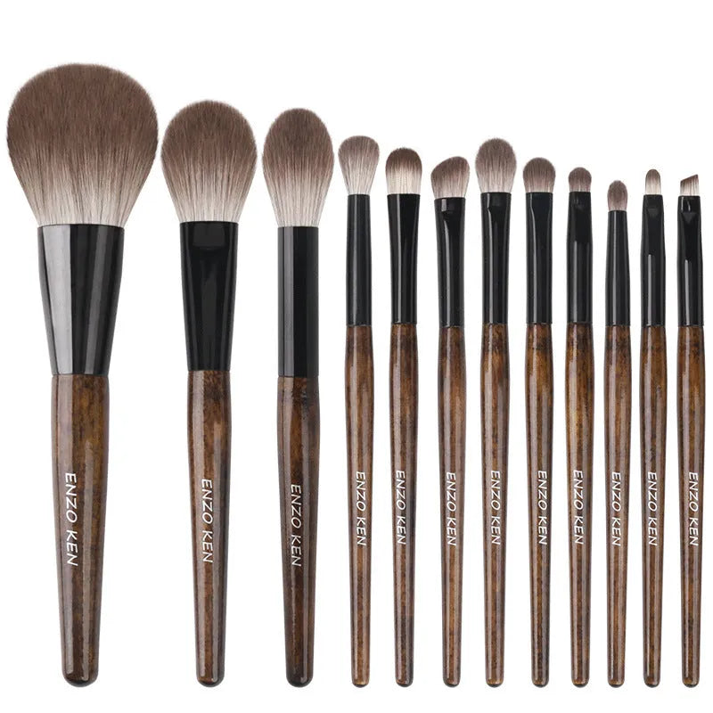12-piece makeup brush set with wooden handles in a black PU carrying case, including a powder foundation brush.