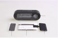 Black electronic car clock and thermometer unit with LED display on adjustable bracket.