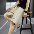 Men's loose fit straight leg beach shorts in various colours with elastic waistband