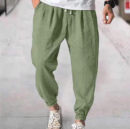 Men's loose cotton summer trousers with banded ankle cuff in light green colour