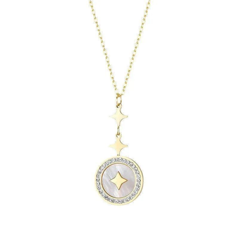 Gold six-pointed star titanium steel necklace on a model, showing the geometric pendant and O-ring chain.