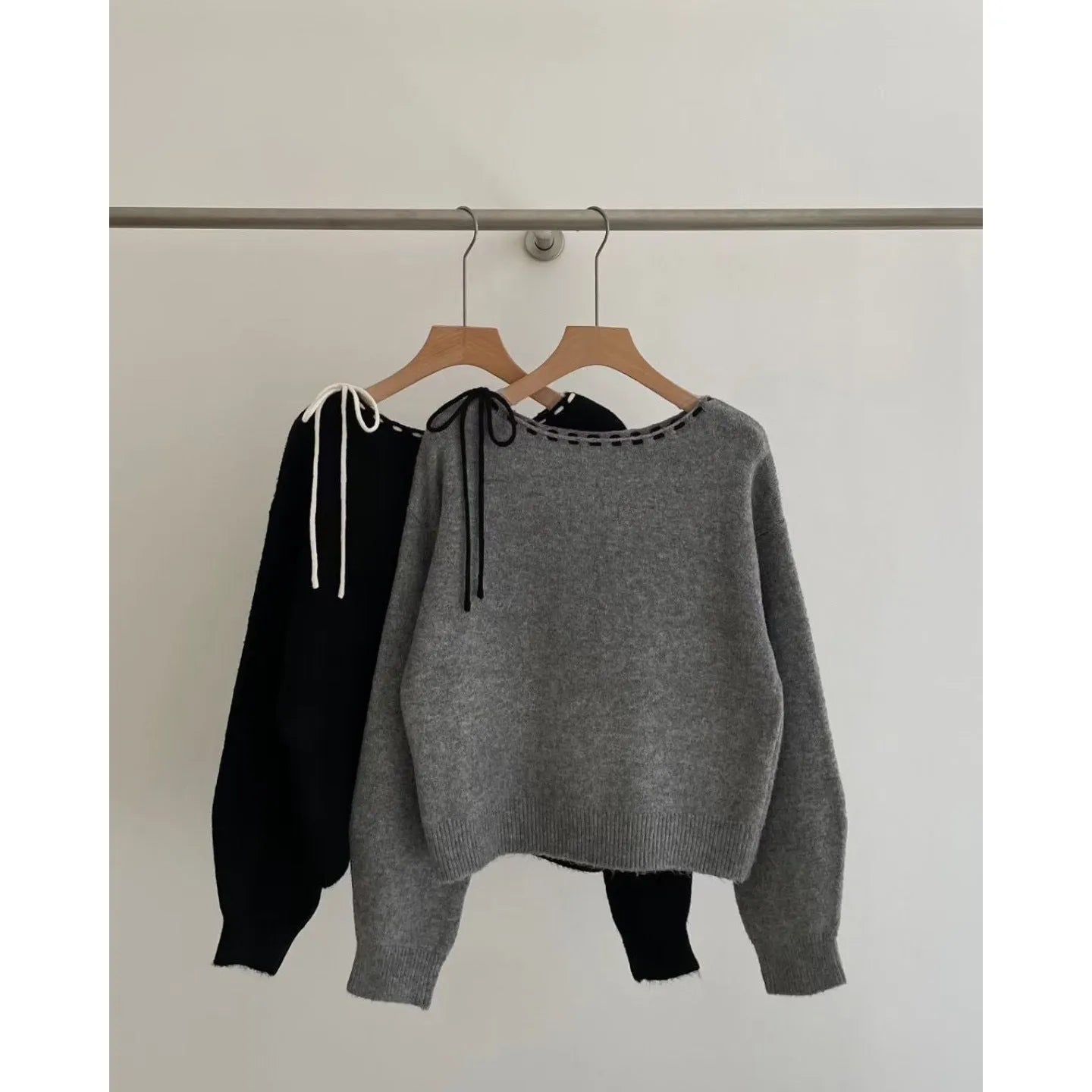 A grey loose-fitting women's knitwear pullover made from regenerated cellulose fibre.
