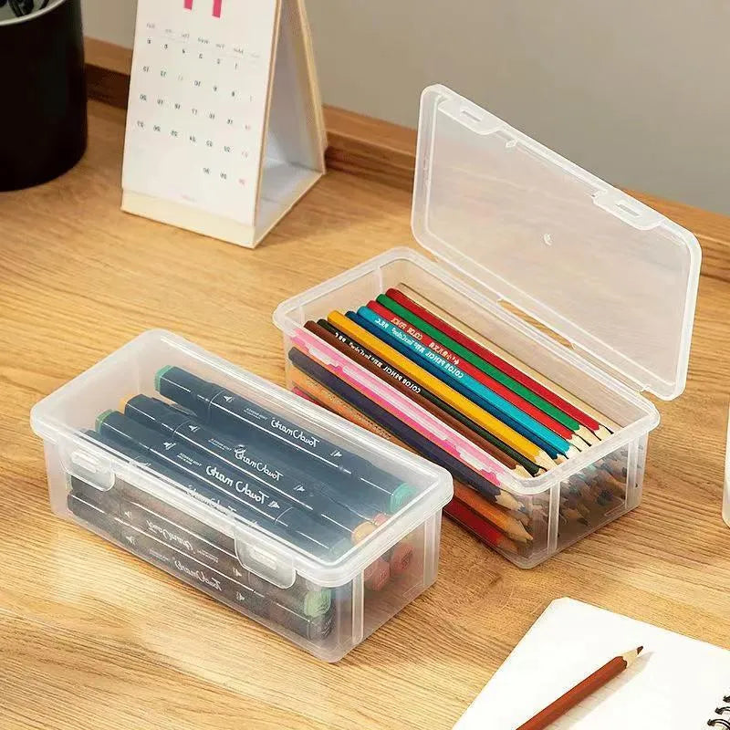 Clear transparent large pencil storage box filled with colouring pencils and crayons