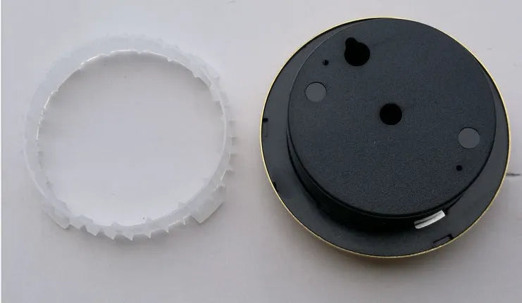 Circular aluminium analogue thermometer and hygrometer showing temperature and humidity dials