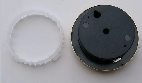Circular aluminium analogue thermometer and hygrometer showing temperature and humidity dials
