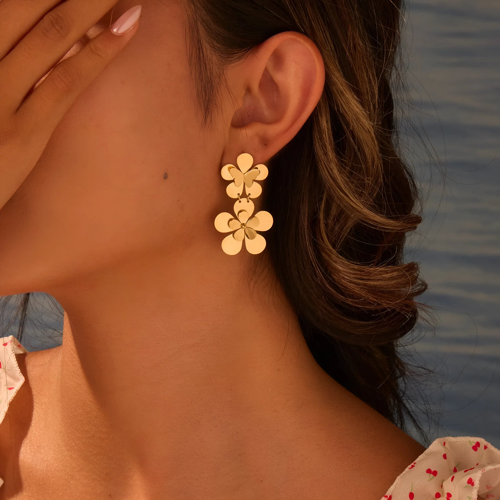 Gold electroplated stainless steel flower butterfly earrings for women with geometric zodiac design