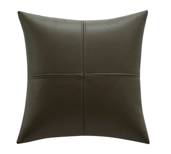 Soft cowhide leather pillow cover in a solid colour, shown in a Nordic-style room setting.