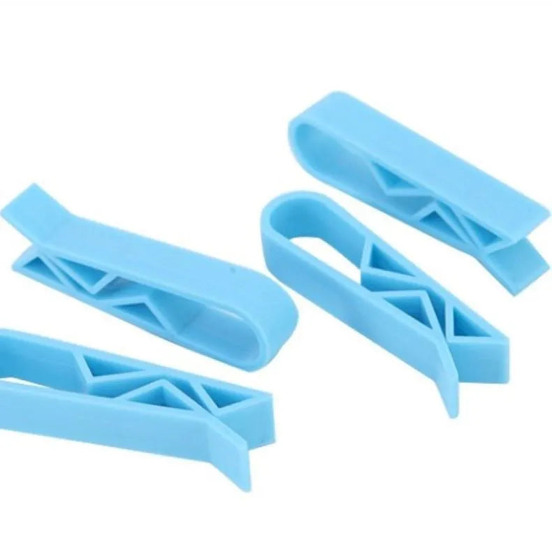 A white PP plastic clip designed to secure a bin bag to the side of a kitchen rubbish bin.
