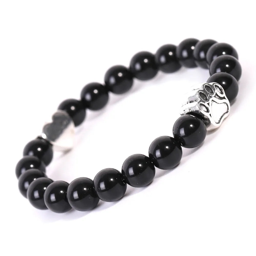 Tigereye Indian Agate stone beaded dog's paw bracelet on wrist, showing geometry shape and round beads.