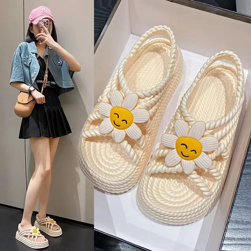 Beige women's round-toe sandals with sunflower pattern and non-slip PVC sole.