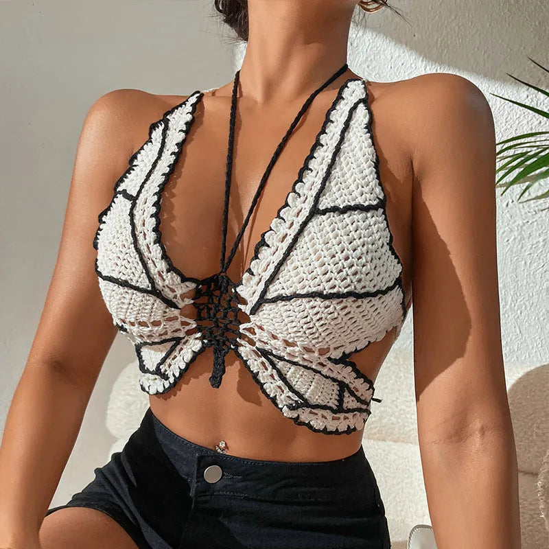 Black and white classic two-piece bikini swimsuit for women on a hanger.