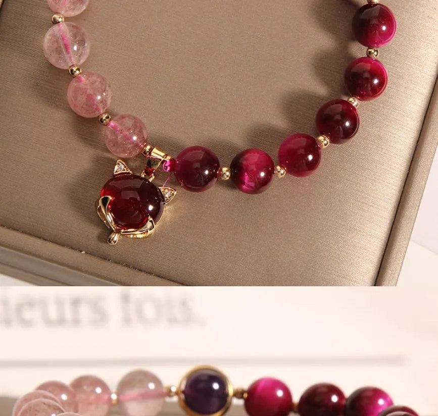 Strawberry crystal elastic bracelet for women on a white background.