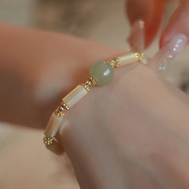 Natural Hetian jade white lip shell bracelet for women with round beads and simple geometric style