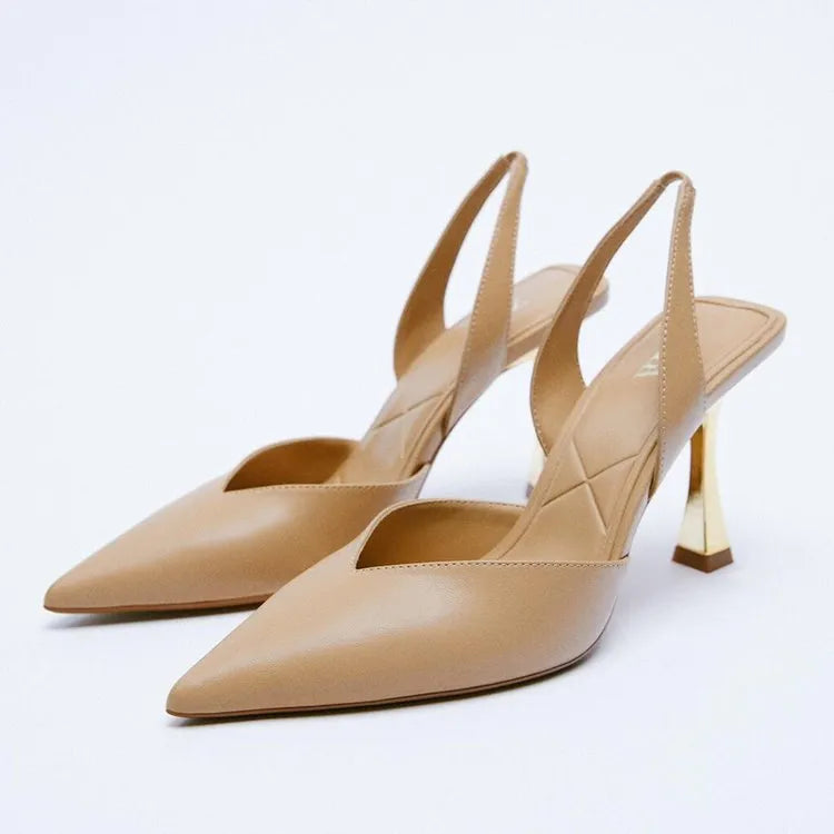Patent leather pointed toe high heels in nude apricot colour with shallow mouth design