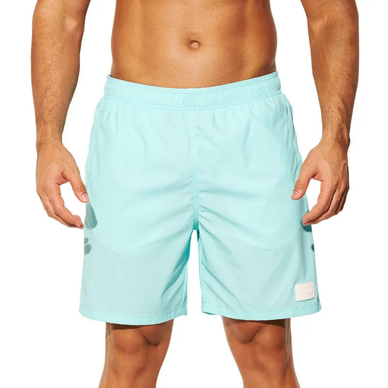 Men's quick-dry nylon sports shorts in solid colours with straight leg design