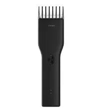 Black cordless hair clipper with ceramic blades and adjustable length comb
